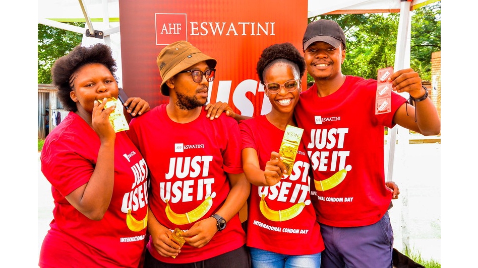 Youth-led advocacy in action – Volunteers from AHF Eswatini proudly display condoms during the International Condom Day celebrations, reinforcing the message: ‘Just Use It’ to prevent HIV and STIs.